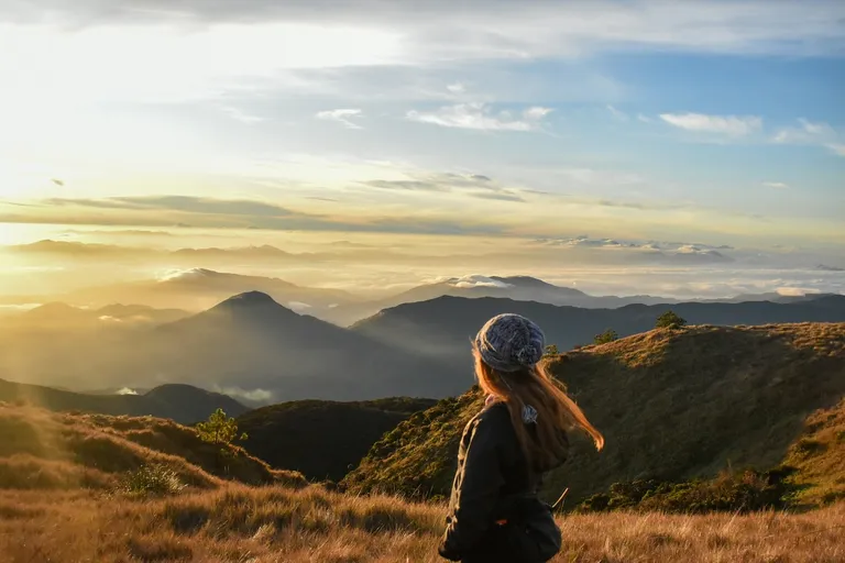 A lady gazing into the mountains
